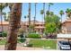 Picturesque view of the community with lush landscaping, mature palm trees, and well-maintained buildings at 10410 N Cave Creek Rd # 2229, Phoenix, AZ 85020