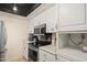 Bright kitchen features white cabinets, stainless steel appliances, and ample counter space at 10410 N Cave Creek Rd # 2229, Phoenix, AZ 85020