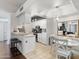 Eat-in kitchen with breakfast bar, white cabinets, and stainless steel appliances at 10410 N Cave Creek Rd # 2229, Phoenix, AZ 85020