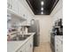 Well-lit kitchen featuring white cabinets, stainless steel appliances, and ample counter space at 10410 N Cave Creek Rd # 2229, Phoenix, AZ 85020
