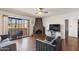 Bright living room features hardwood floors, unique fireplace, and sliding glass doors to the patio at 10410 N Cave Creek Rd # 2229, Phoenix, AZ 85020