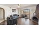 Inviting living room featuring hardwood floors, comfortable furniture, and a sliding glass door to the patio at 10410 N Cave Creek Rd # 2229, Phoenix, AZ 85020