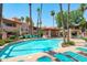 Community pool area features a sparkling pool, comfortable lounge chairs, and desert landscaping at 10410 N Cave Creek Rd # 2229, Phoenix, AZ 85020