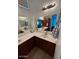 Bright bathroom with dual sink vanity, plenty of counter space and a modern light fixture at 1350 S Greenfield Rd # 1219, Mesa, AZ 85206