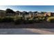 Relaxing community pool area featuring a pergola, lush landscaping, and comfortable seating for residents at 1350 S Greenfield Rd # 1219, Mesa, AZ 85206