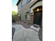 Two-story home featuring a modern door, stone accents, walkway, and manicured landscaping at 1350 S Greenfield Rd # 1219, Mesa, AZ 85206