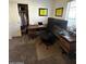 Functional home office with a spacious desk and a comfortable chair at 1350 S Greenfield Rd # 1219, Mesa, AZ 85206
