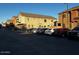 Exterior parking lot view of two-story homes with attached balconies at 1350 S Greenfield Rd # 1219, Mesa, AZ 85206
