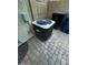 Outdoor patio featuring climate control system and waste management containers at 1350 S Greenfield Rd # 1219, Mesa, AZ 85206