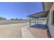 Expansive backyard with desert landscaping, a covered patio, and a sparkling pool, perfect for outdoor enjoyment at 14014 N 39Th Ave, Phoenix, AZ 85053