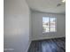 Bedroom featuring gray wood-look floors and white trim at 14014 N 39Th Ave, Phoenix, AZ 85053