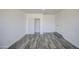 This bedroom offers ample closet space, new wood-look floors and a neutral color palette at 14014 N 39Th Ave, Phoenix, AZ 85053