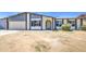 Inviting single-story home with two-car garage, arched doorway, and picture windows at 14014 N 39Th Ave, Phoenix, AZ 85053