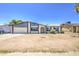 Single-story house featuring an attached two-car garage, manicured bushes, and large picture windows at 14014 N 39Th Ave, Phoenix, AZ 85053