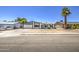 Inviting single-story home with an attached garage, an arched entry way, and a well-kept yard at 14014 N 39Th Ave, Phoenix, AZ 85053