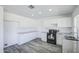 Updated kitchen showcasing white cabinets, granite countertops, and modern appliances at 14014 N 39Th Ave, Phoenix, AZ 85053