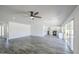 Expansive living space boasts an open layout, ceiling fan, and access to the kitchen at 14014 N 39Th Ave, Phoenix, AZ 85053