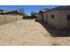 Expansive dirt backyard offering plenty of potential and featuring a shed and block wall at 14214 N 36Th Ave, Phoenix, AZ 85053