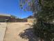 View of backyard showcasing a wood fence, block wall, desert landscaping, and palm trees at 14214 N 36Th Ave, Phoenix, AZ 85053