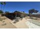 Backyard pool, covered patio, grill, and palm trees creating a private oasis at 14214 N 36Th Ave, Phoenix, AZ 85053