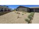 Modest single-story home featuring a low-maintenance gravel front yard at 14214 N 36Th Ave, Phoenix, AZ 85053