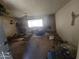 Cozy living room with a fireplace and large window allowing plenty of natural light at 14214 N 36Th Ave, Phoenix, AZ 85053