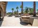 Spacious backyard with water feature, grill, and seating areas provides a relaxing outdoor living space at 15953 W Catalina Dr, Goodyear, AZ 85395