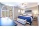 Bedroom featuring a unique window, ceiling fan, modern décor, and neutral walls at 15953 W Catalina Dr, Goodyear, AZ 85395