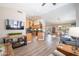 Bright open concept living and kitchen area with wood laminate flooring and plenty of natural light at 15953 W Catalina Dr, Goodyear, AZ 85395