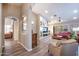 Cozy living room area with built-in entertainment center and comfortable furnishings at 15953 W Catalina Dr, Goodyear, AZ 85395