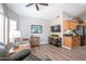 Inviting living area featuring modern decor, vaulted ceilings, and stylish wood laminate flooring at 15953 W Catalina Dr, Goodyear, AZ 85395
