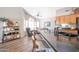 Cozy living space featuring hardwood floors, vaulted ceilings, natural light, and a large island overlooking a comfortable sitting area at 15953 W Catalina Dr, Goodyear, AZ 85395