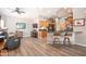 Inviting living area with kitchen bar, wooden cabinets, sleek countertops and open floor plan, perfect for entertaining guests at 15953 W Catalina Dr, Goodyear, AZ 85395