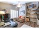 Office space with wood floors, vaulted ceilings, ceiling fan, and built-in shelving at 15953 W Catalina Dr, Goodyear, AZ 85395