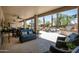 Outdoor patio with stone flooring, outdoor seating, ceiling fans, and summer kitchen at 15953 W Catalina Dr, Goodyear, AZ 85395