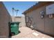 A small gated side yard contains the home's utilities and waste management at 15953 W Catalina Dr, Goodyear, AZ 85395