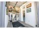 A functional storage area off of the garage features built-in shelving at 15953 W Catalina Dr, Goodyear, AZ 85395