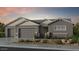 Charming single-story home featuring a three-car garage and neutral color palette at 18924 E Celtic Manor Dr, Queen Creek, AZ 85142
