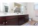 Bathroom features a double sink vanity with modern fixtures and decor at 19461 N Rose Rd, Maricopa, AZ 85138