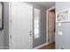 Bright entryway featuring a white door, gray walls, and decorative accents for a clean, modern look at 19461 N Rose Rd, Maricopa, AZ 85138