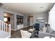 Spacious living room with an open layout, stylish decor, and seamless flow into other areas of the home at 19461 N Rose Rd, Maricopa, AZ 85138