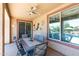 Covered patio featuring a ceiling fan, dining set, and views of the backyard at 19461 N Rose Rd, Maricopa, AZ 85138