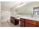 Bathroom featuring double vanity, tile floors, and a shower-tub combo at 2000 N 36Th St # 30, Phoenix, AZ 85008