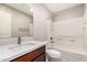 Bright bathroom with a modern sink and a white shower-tub combo at 2000 N 36Th St # 30, Phoenix, AZ 85008