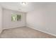 Comfortable bedroom with neutral carpeting and a large window at 2000 N 36Th St # 30, Phoenix, AZ 85008
