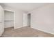 Bedroom featuring neutral carpeting and an adjacent walk-in closet at 2000 N 36Th St # 30, Phoenix, AZ 85008