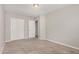 Bedroom featuring neutral carpeting, an adjacent walk-in closet, and a standard closet at 2000 N 36Th St # 30, Phoenix, AZ 85008