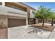 Modern two-story home with a two-car garage and desert landscaping at 2000 N 36Th St # 30, Phoenix, AZ 85008