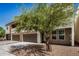 Modern two-story home with stone accents, two-car garage, and desert landscaping at 2000 N 36Th St # 30, Phoenix, AZ 85008