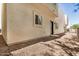 Home exterior features stucco siding, gravel landscaping, and minimal lawn at 2000 N 36Th St # 30, Phoenix, AZ 85008